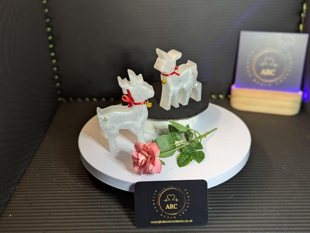 Cute Mother and Baby Reindeer with red collar and gold bell